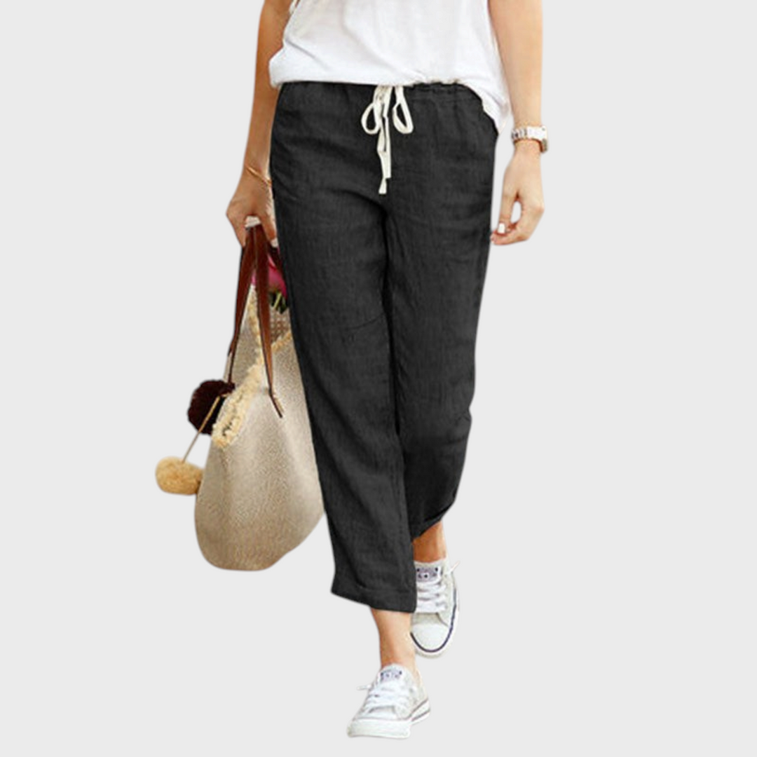 Calças casuais pretas Liselotte Salzburg com cintura de cordão e bainha dobrada, estilo streetwear confortável.