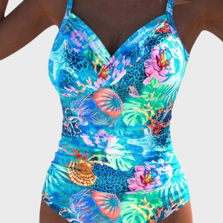 Badeanzug Meloryanne da Liselotte Salzburg com padrão floral e marinho vibrante em tons de azul e rosa