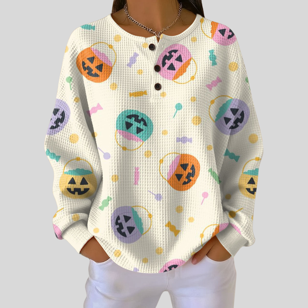 Léonie – Crèmefarbener Pulli mit Halloween-Kürbissen