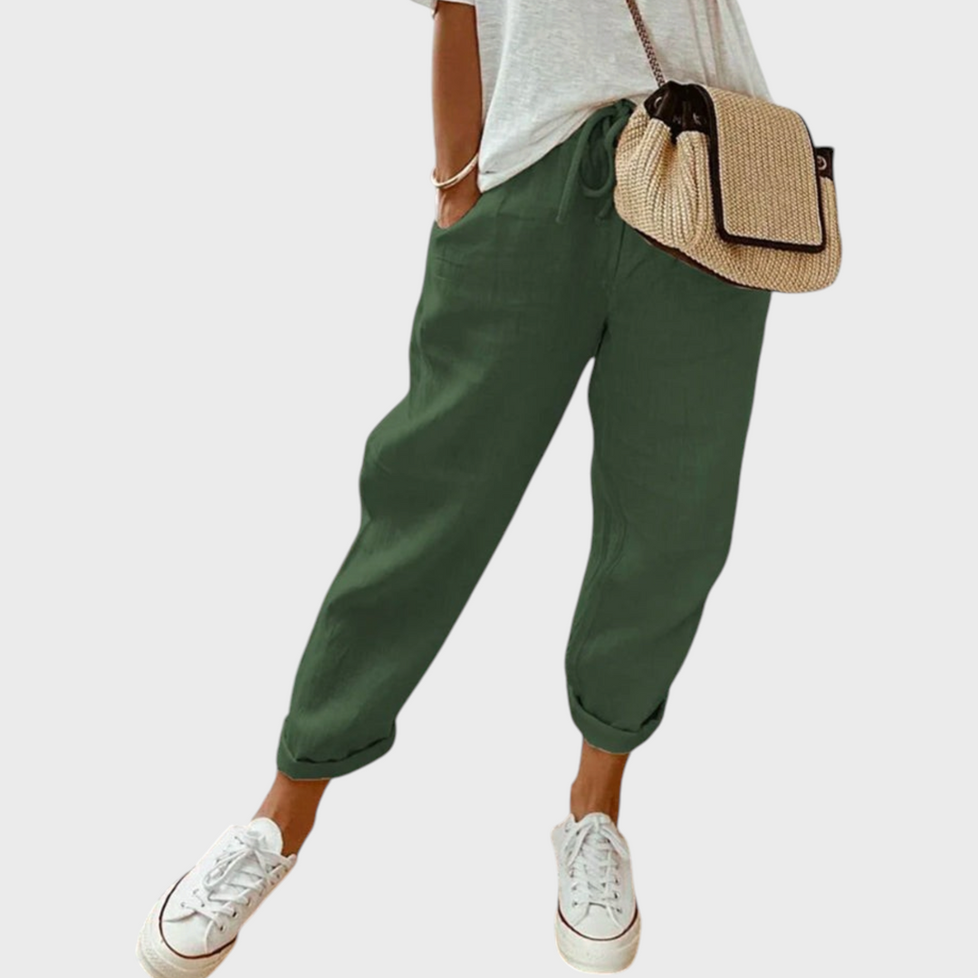 Calças largas verde-escuras Liselotte Salzburg com cintura elástica, bolsos laterais e ajuste confortável e fluido.