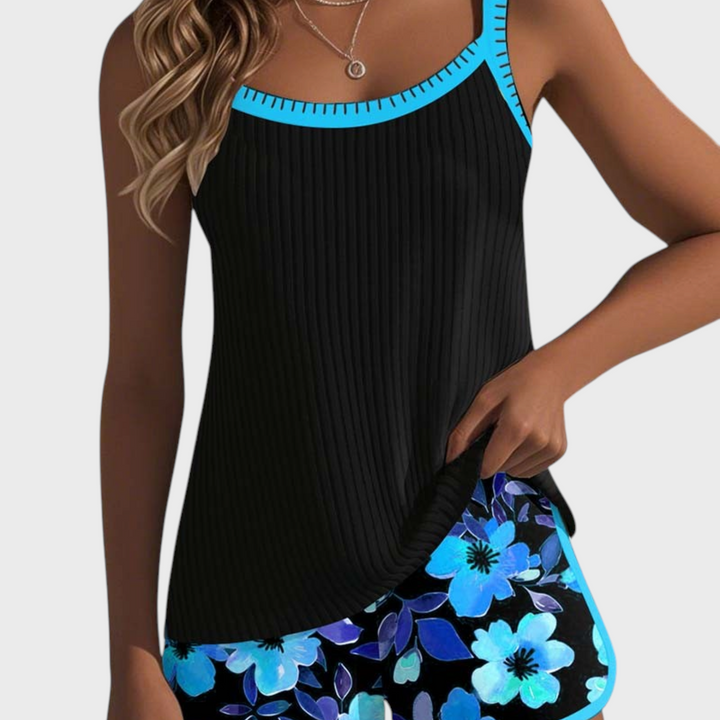 Tankini de duas peças Liselotte Salzburg com top preto canelado e calções com padrão floral azul