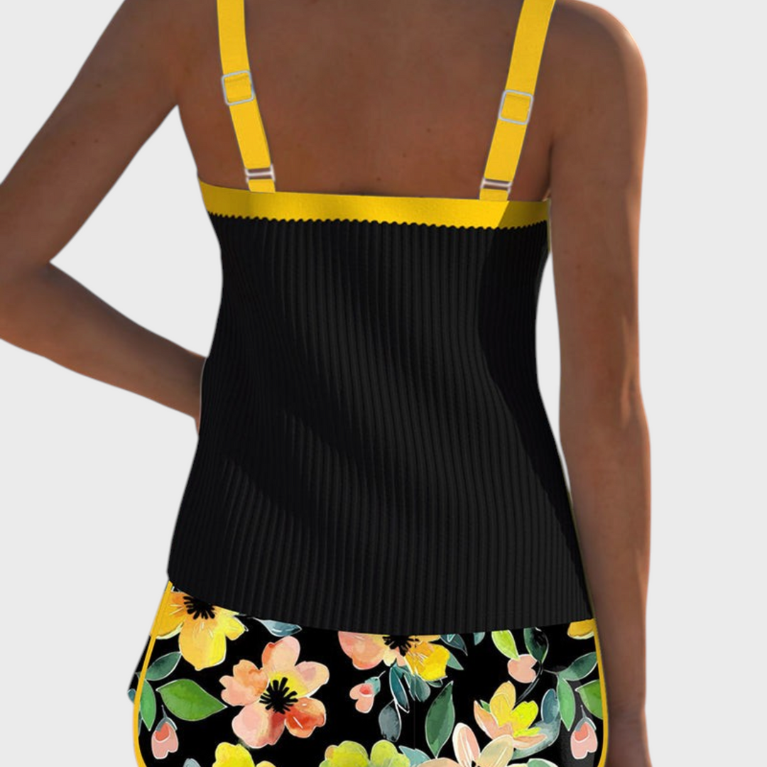 Tankini de duas peças Liselotte Salzburg com top preto canelado, alças amarelas e cueca com padrão floral colorido