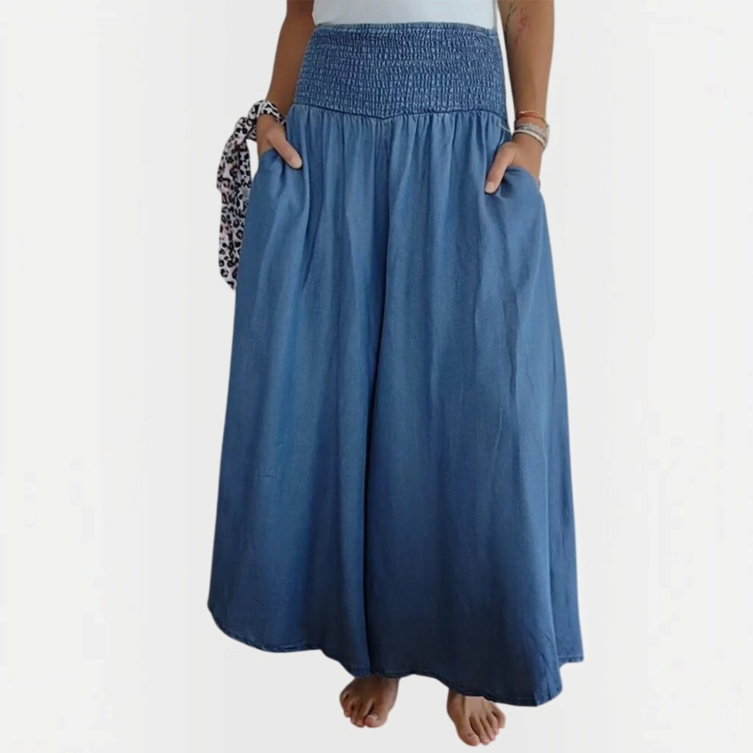 Calças largas Liselotte Salzburg em ganga azul com cintura elástica franzida e bolsos laterais práticos