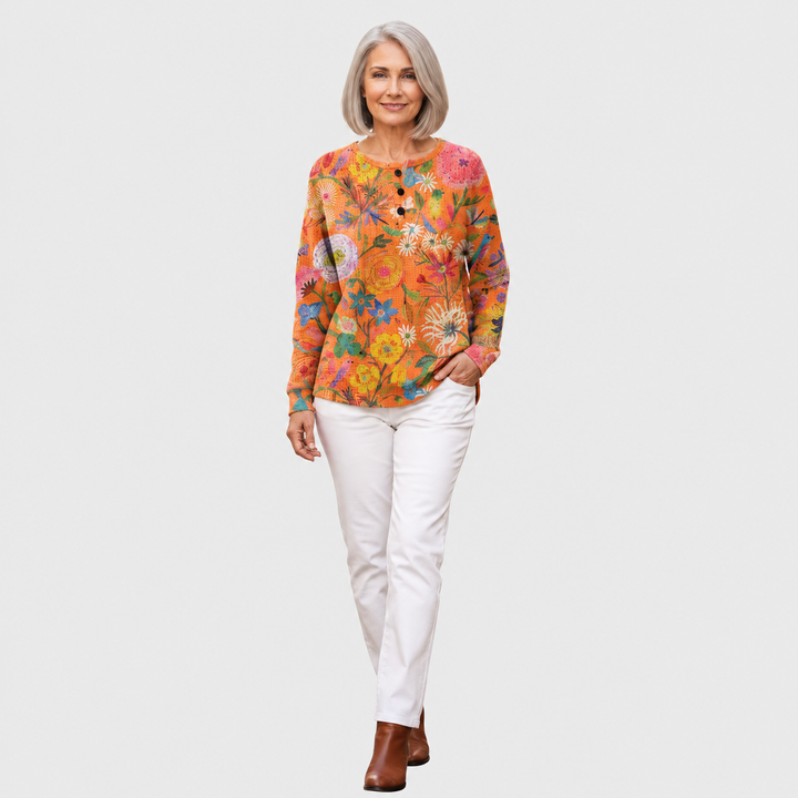 Florence – Orangefarbener Pulli mit Blumen