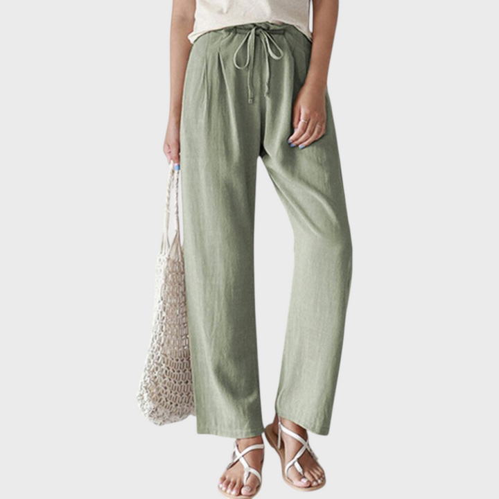 Calças relaxadas Liselotte Salzburg em algodão verde, corte reto, cintura subida com cordão e estilo minimalista.