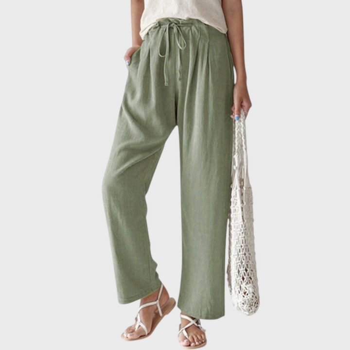 Calças de relaxamento Liselotte Salzburg em algodão verde, corte reto, cintura subida com cordão e bolsos laterais.
