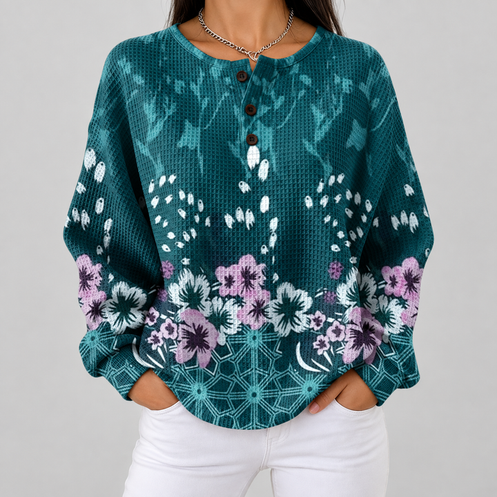 Yolande – Türkiser Pulli mit Blümchen