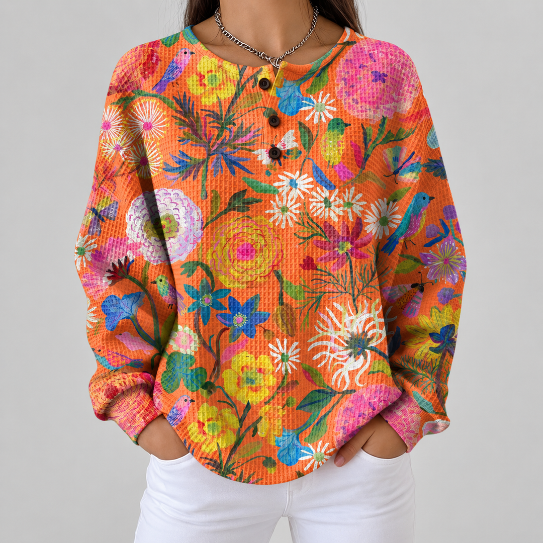 Florence – Orangefarbener Pulli mit Blumen