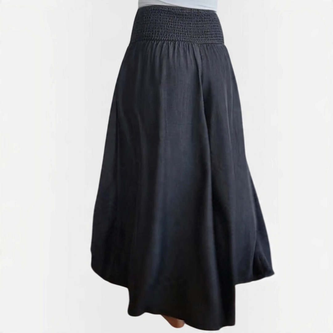 Calças largas Liselotte Salzburg pretas com cintura elástica franzida e corte fluido estilo boho