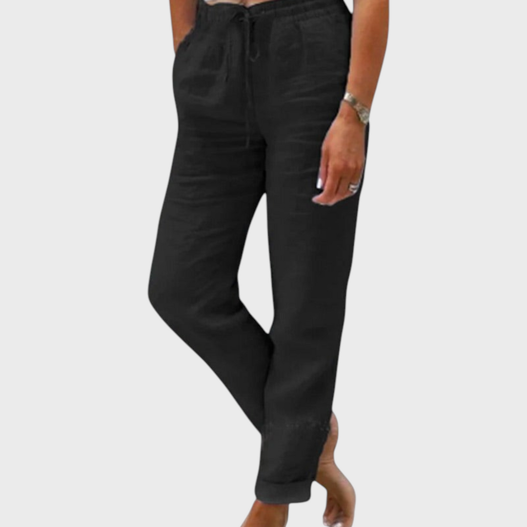 Calças pretas elegantes Liselotte Salzburg com cintura elástica e cordão, corte justo e estilo casual versátil.