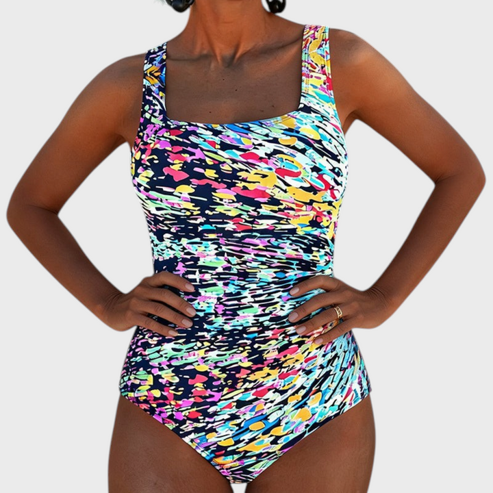 Badeanzug Marga da Liselotte Salzburg com padrão colorido abstrato e decote quadrado, ideal para praia e piscina.