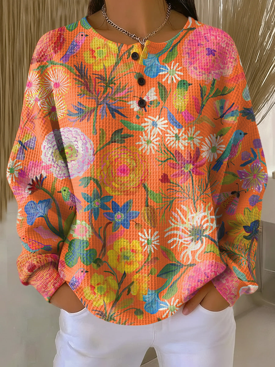 Florence – Orangefarbener Pulli mit Blumen