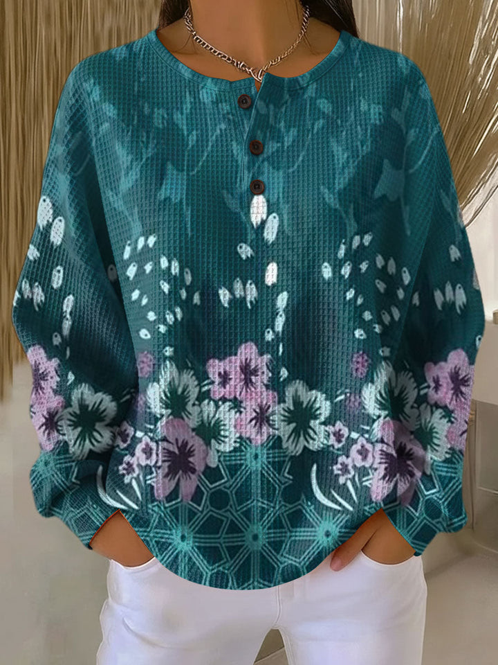 Yolande – Türkiser Pulli mit Blümchen